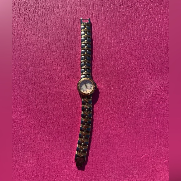 Bulova Accessories - Bulova women’s watch silver gold color (two-tone)